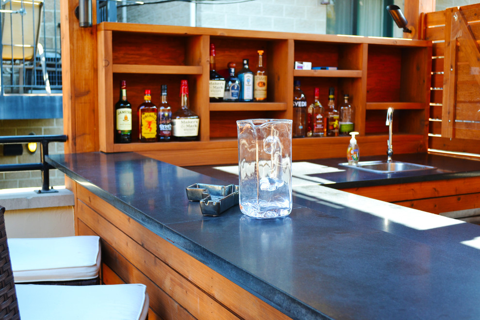 Inspiration for a mid-sized transitional rooftop outdoor kitchen deck remodel in Chicago with decking and a roof extension