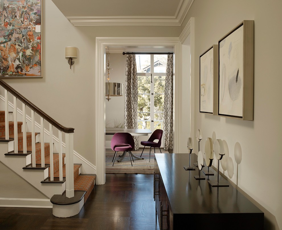 Inspiration for a contemporary foyer in San Francisco with beige walls, dark hardwood floors and brown floor.
