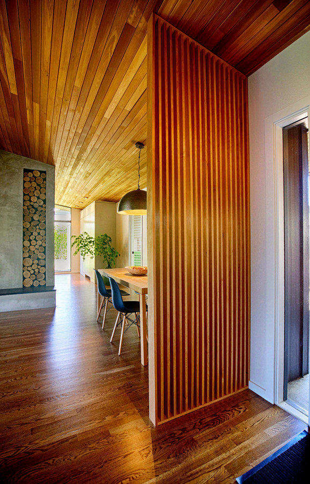Photo of a midcentury dining room in Portland.