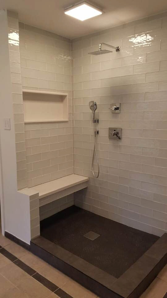 Medium sized ensuite bathroom in Houston with shaker cabinets, white cabinets, a corner shower, a one-piece toilet, white tiles, cement tiles, white walls, ceramic flooring, a console sink, marble worktops, brown floors, an open shower, white worktops, a single sink, a built in vanity unit and a coffered ceiling.