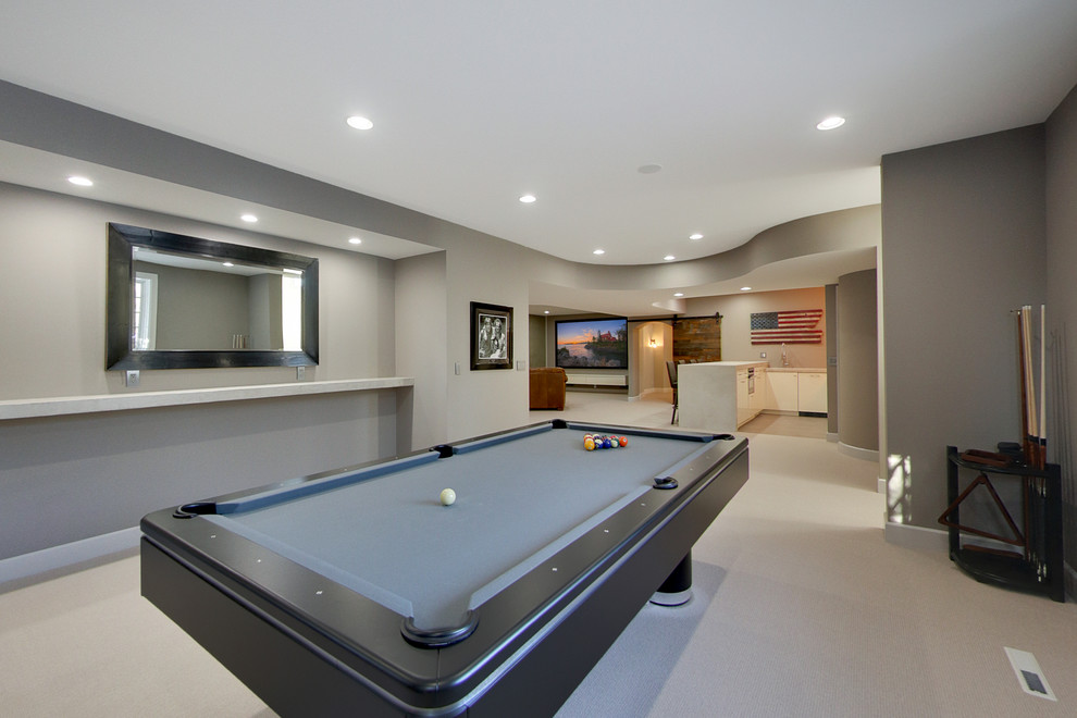 Inspiration for a mid-sized contemporary fully buried basement in Minneapolis with grey walls, carpet, a standard fireplace and a game room.