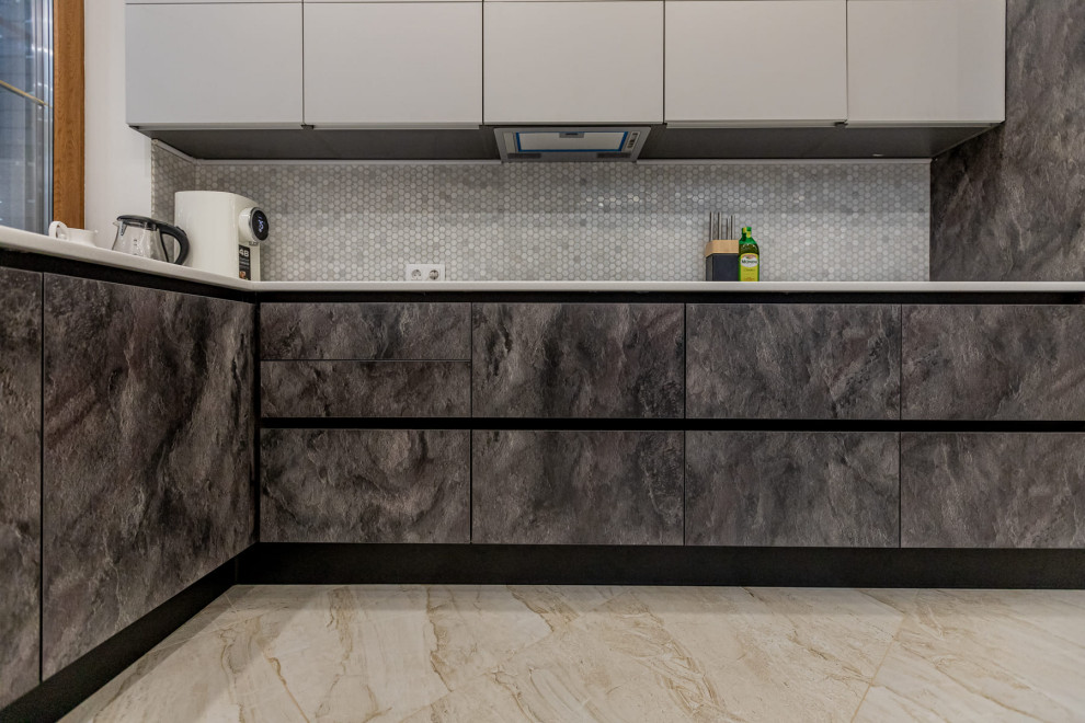 Inspiration for a large contemporary l-shaped eat-in kitchen in Saint Petersburg with an undermount sink, raised-panel cabinets, grey cabinets, solid surface benchtops, grey splashback, mosaic tile splashback, white appliances, porcelain floors, no island, beige floor, grey benchtop and recessed.