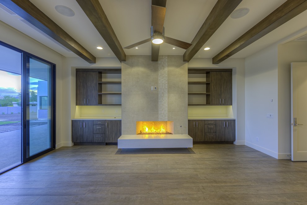 Photo of a large modern master bedroom in Phoenix with beige walls, dark hardwood floors, no fireplace and beige floor.
