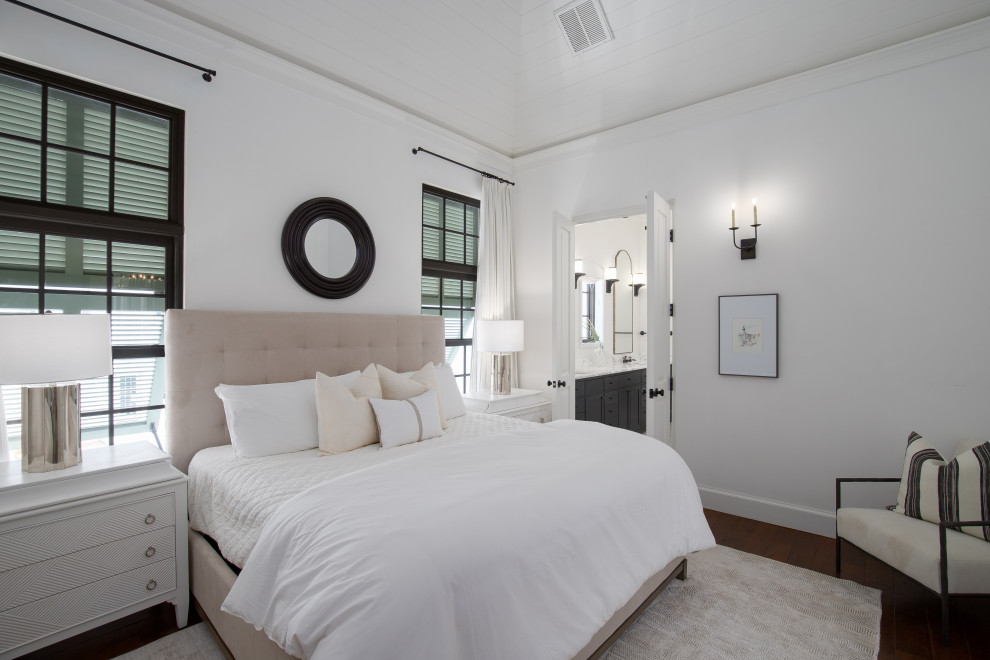 Inspiration for a beach style guest bedroom with white walls.