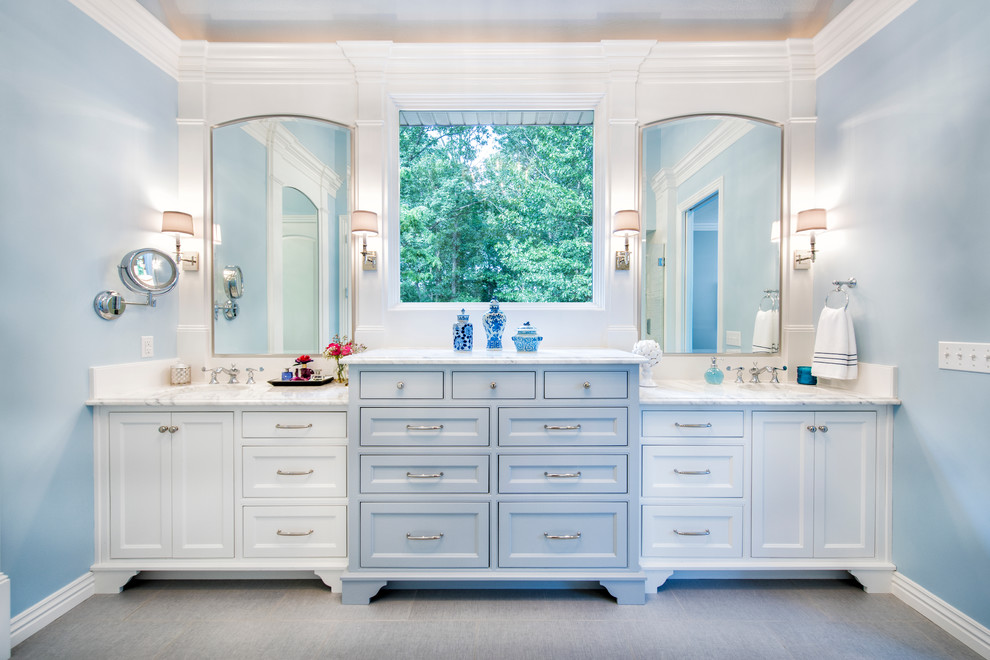 Inspiration for a mid-sized transitional master porcelain tile porcelain tile doorless shower remodel with beaded inset cabinets, white cabinets, quartz countertops, blue walls and an undermount sink