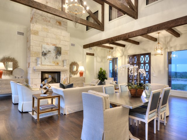 Hand-stressed wood beams and native stone fireplace add both drama and warmth to the great room.