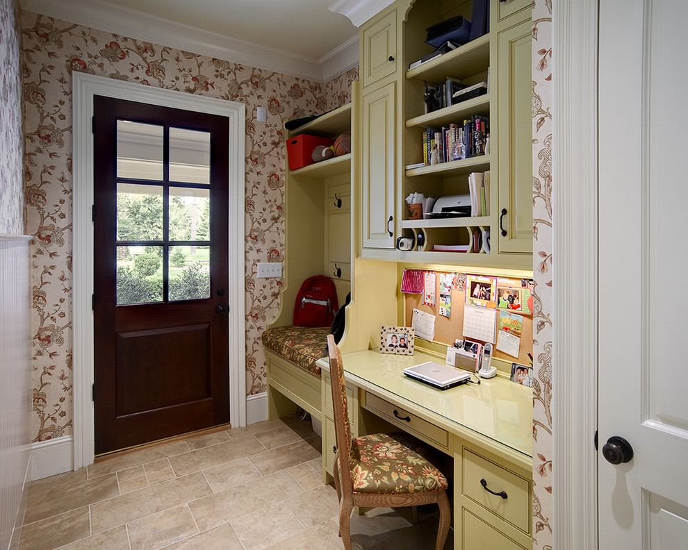 This is an example of a small traditional home office in Raleigh with a built-in desk.