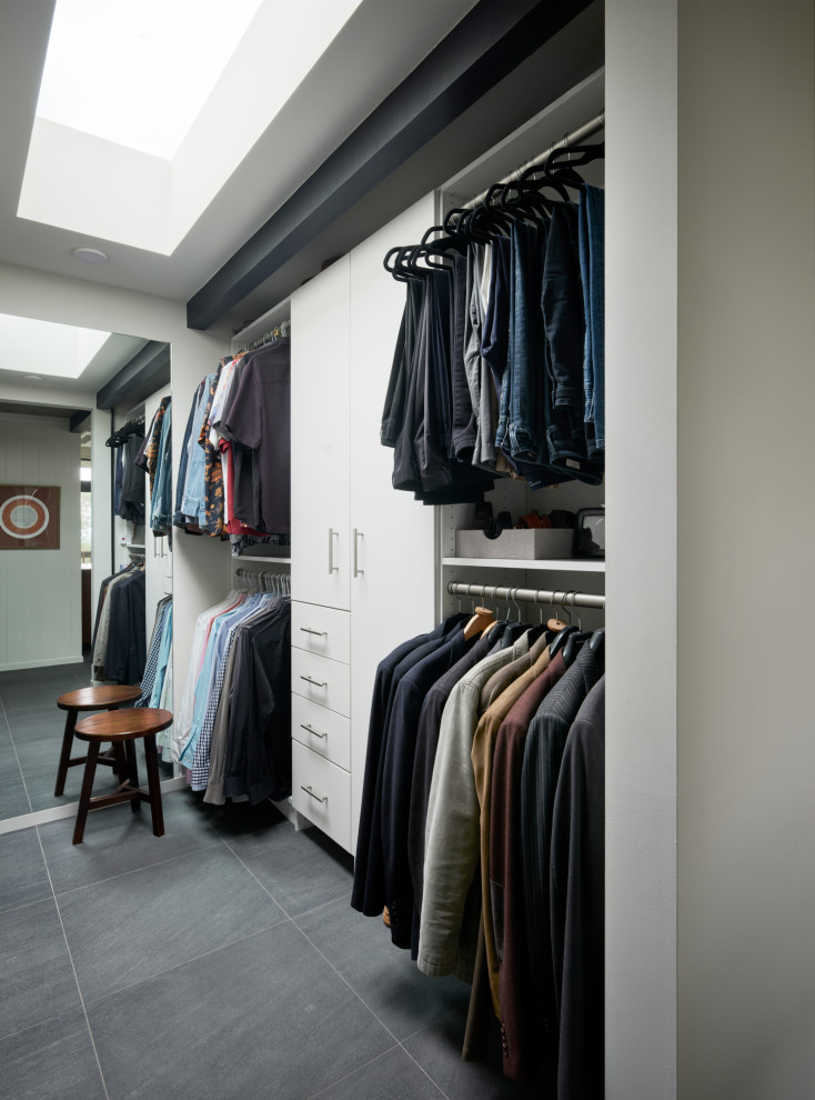 1960s men's gray floor walk-in closet photo in San Francisco with flat-panel cabinets and white cabinets