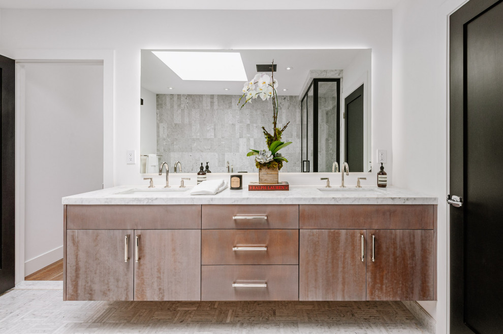Mid-sized country master bathroom in Los Angeles with recessed-panel cabinets, distressed cabinets, gray tile, marble, white walls, an undermount sink, marble benchtops and white benchtops.