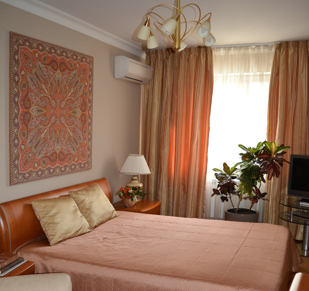 This is an example of a mid-sized transitional bedroom in Other with beige walls.