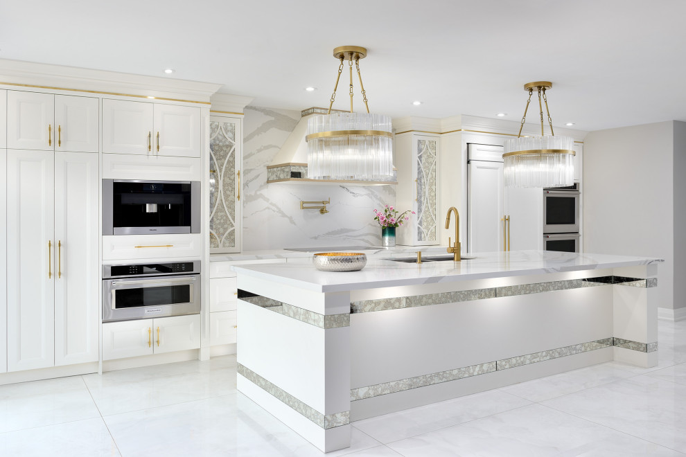 Design ideas for a l-shaped eat-in kitchen in Toronto with a double-bowl sink, white cabinets, marble benchtops, white splashback, marble splashback, coloured appliances, marble floors, with island, white floor and white benchtop.
