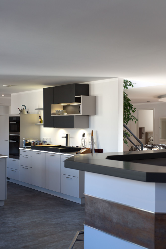 Inspiration for a contemporary kitchen in Other with a peninsula.