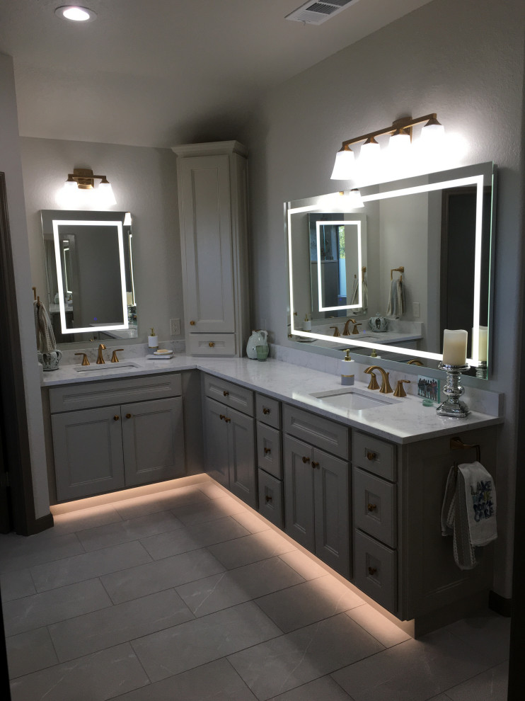 Design ideas for a mid-sized transitional master bathroom in Austin with raised-panel cabinets, grey cabinets, an open shower, a two-piece toilet, gray tile, porcelain floors, an undermount sink, engineered quartz benchtops, grey floor, an open shower, beige benchtops, a shower seat, a double vanity and a built-in vanity.