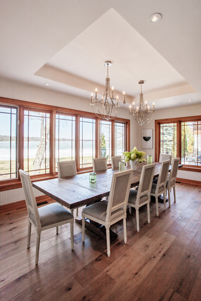 Large beach style kitchen/dining combo in Toronto with white walls, light hardwood floors and no fireplace.