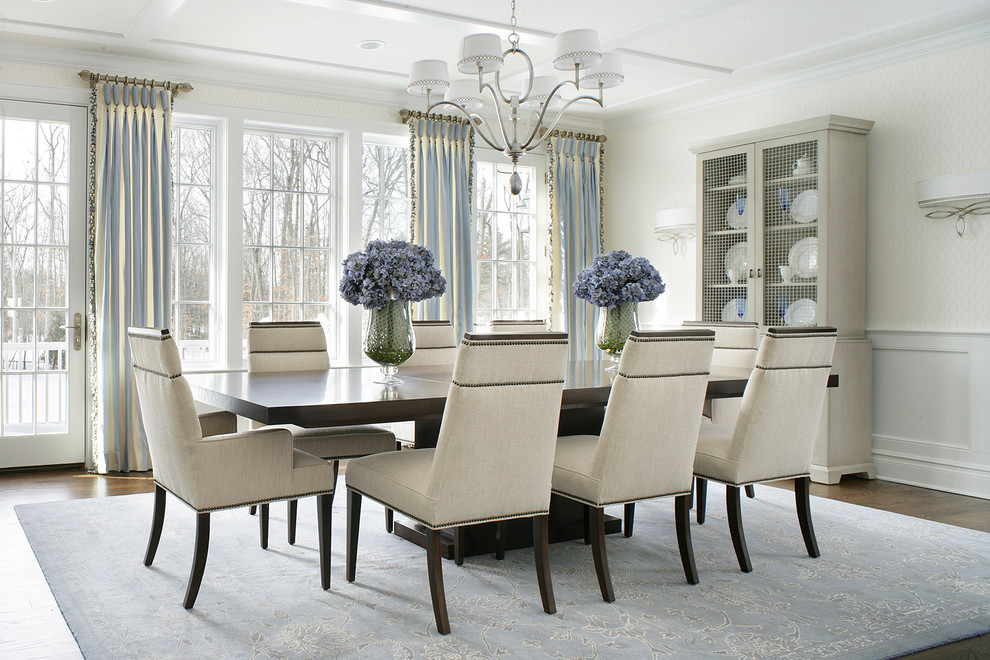 Inspiration for a transitional dining room in New York with beige walls and medium hardwood floors.