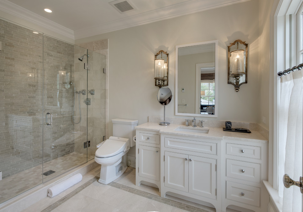 Design ideas for a traditional 3/4 bathroom in New York with beaded inset cabinets, white cabinets, an alcove shower, gray tile, grey walls, an undermount sink, grey floor, a hinged shower door and white benchtops.