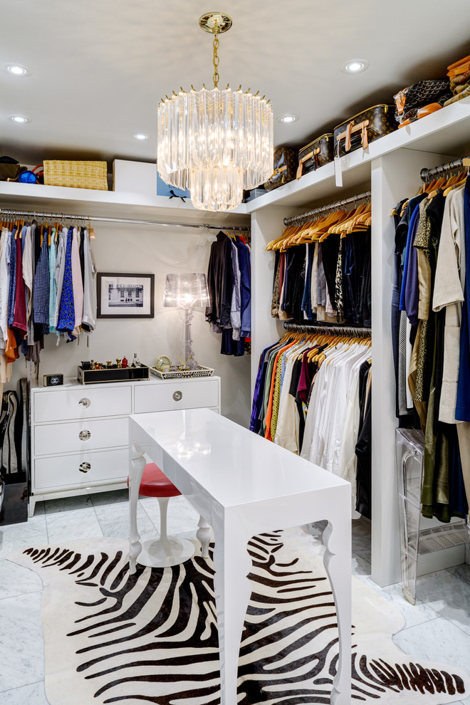 This is an example of a contemporary women's walk-in wardrobe in Seattle with open cabinets, white cabinets and marble floors.