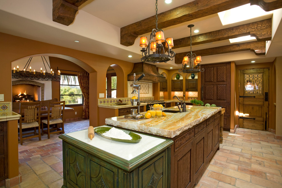 This is an example of a mediterranean kitchen in San Diego with granite benchtops.