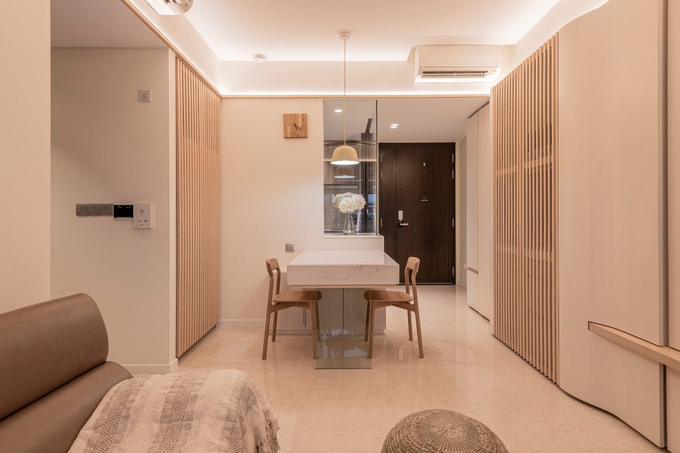 This is an example of a transitional dining room in Singapore.