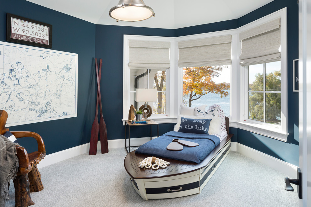 Mid-sized beach style gender-neutral kids' room in Minneapolis with blue walls, grey floor and carpet.