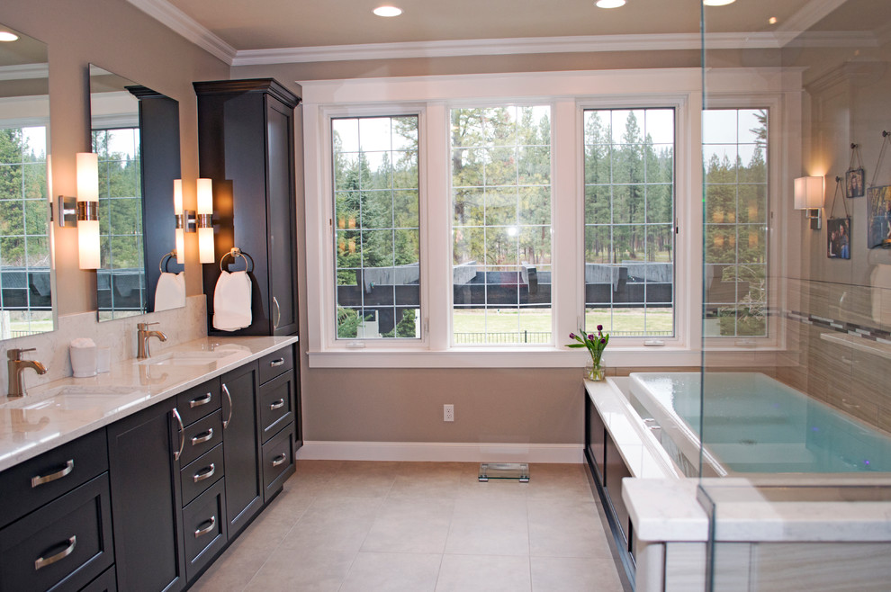 Inspiration for a large transitional beige tile and porcelain tile porcelain tile sauna remodel in Seattle with an undermount sink, shaker cabinets, gray cabinets, quartz countertops, an undermount tub, a bidet and gray walls