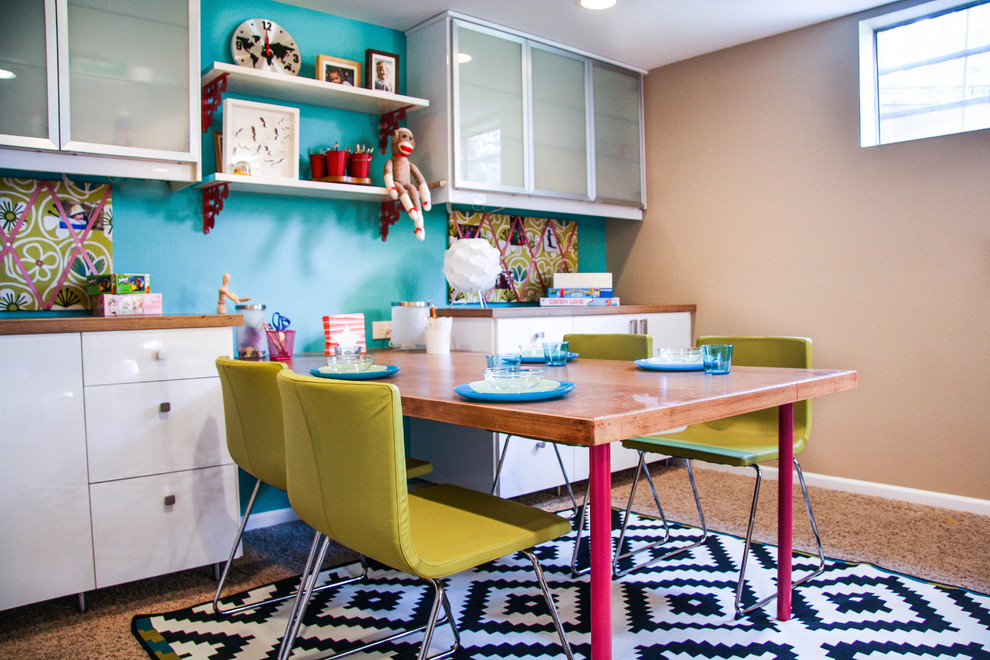 Inspiration for a contemporary kids' playroom for kids 4-10 years old and girls in Denver with blue walls.
