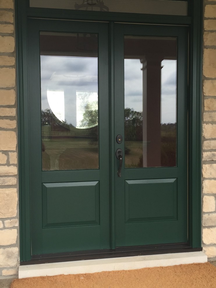 Design ideas for a mid-sized traditional front door in Louisville with a double front door and a green front door.