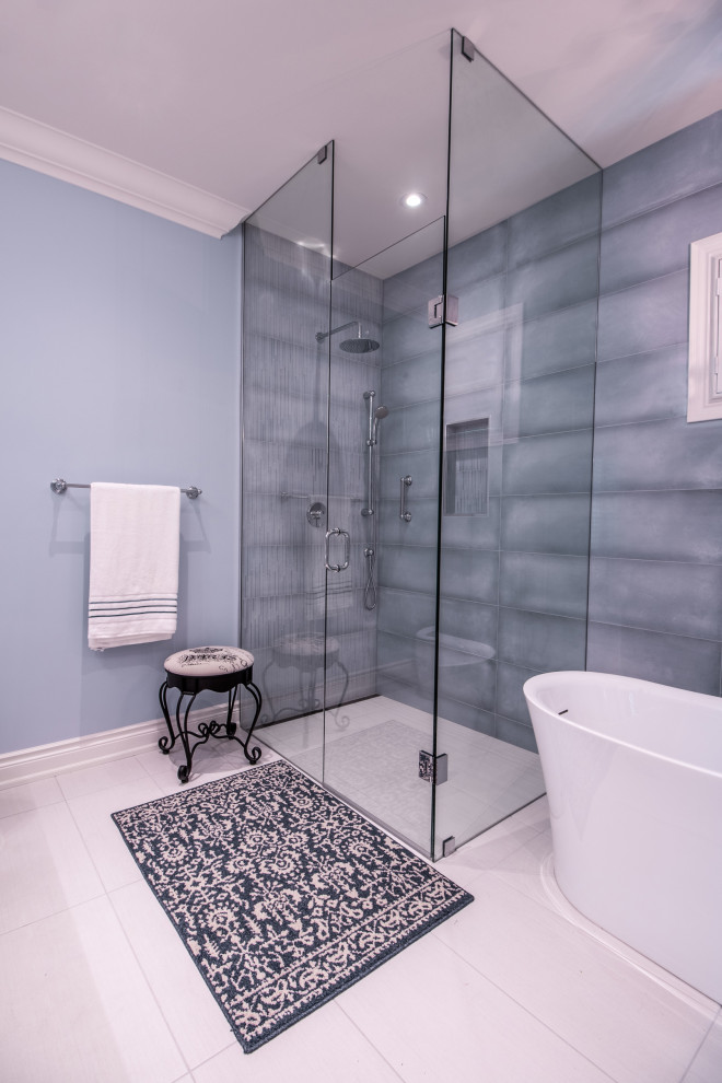 Mid-sized contemporary master bathroom in Toronto with flat-panel cabinets, white cabinets, a freestanding tub, a curbless shower, porcelain floors, a trough sink, engineered quartz benchtops, a hinged shower door and white benchtops.