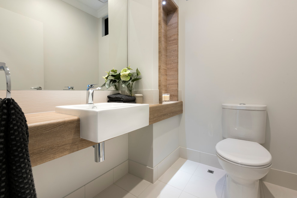Contemporary powder room in Perth with white tile and ceramic tile.