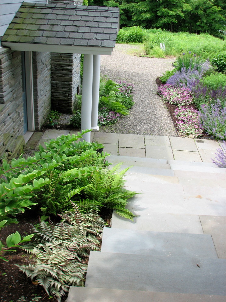Inspiration for a mid-sized beach style front yard full sun garden in New York with gravel and a garden path.
