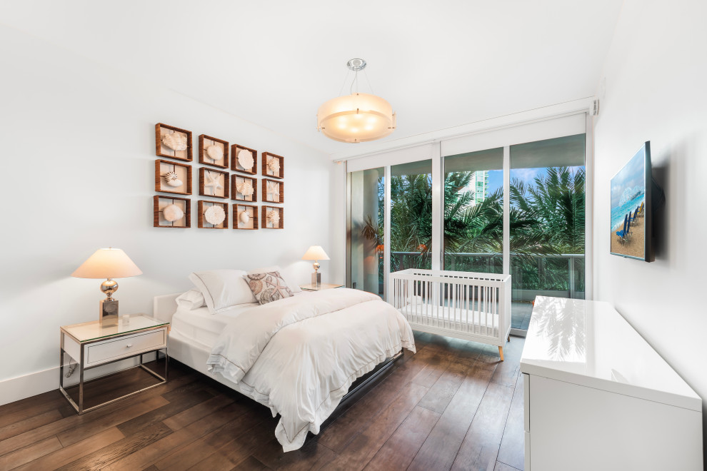 Inspiration for a mid-sized contemporary master light wood floor and brown floor bedroom remodel in Miami with white walls and no fireplace