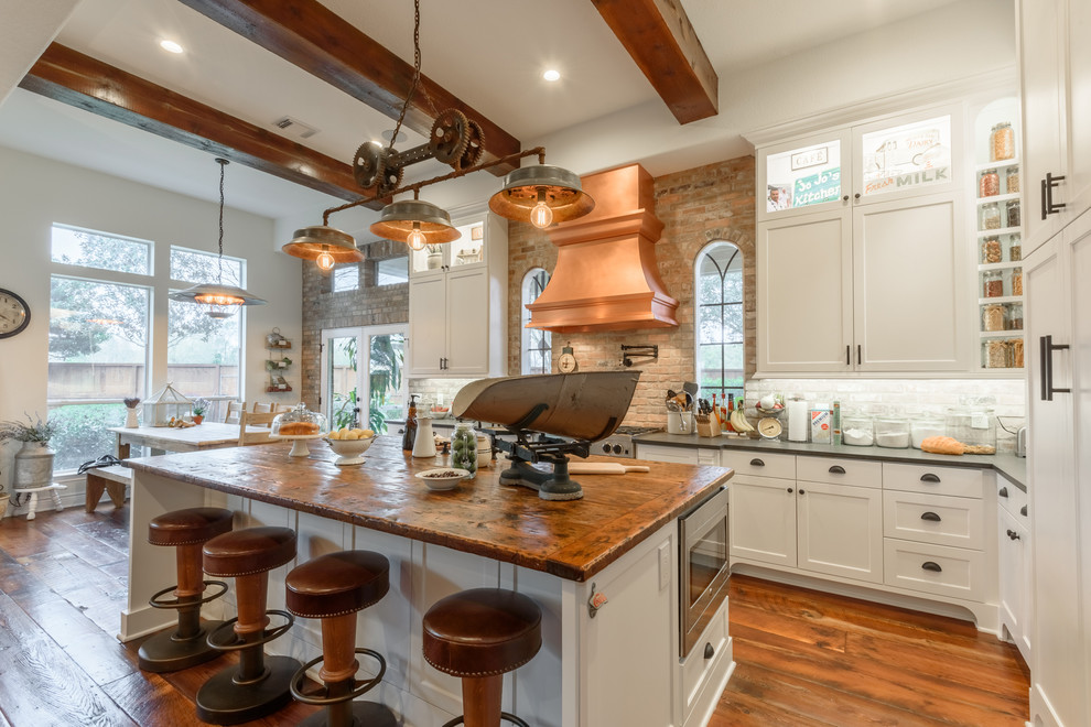 Example of a transitional kitchen design in Houston