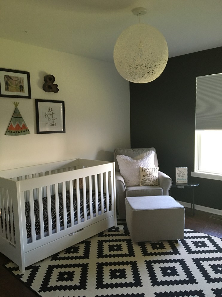 Mid-sized transitional nursery in Chicago with white walls and dark hardwood floors.