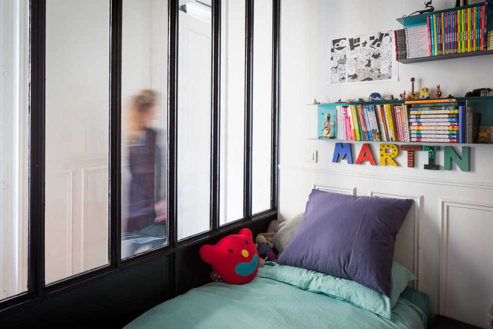 Photo of a mid-sized industrial kids' bedroom for kids 4-10 years old and boys in Paris with white walls.