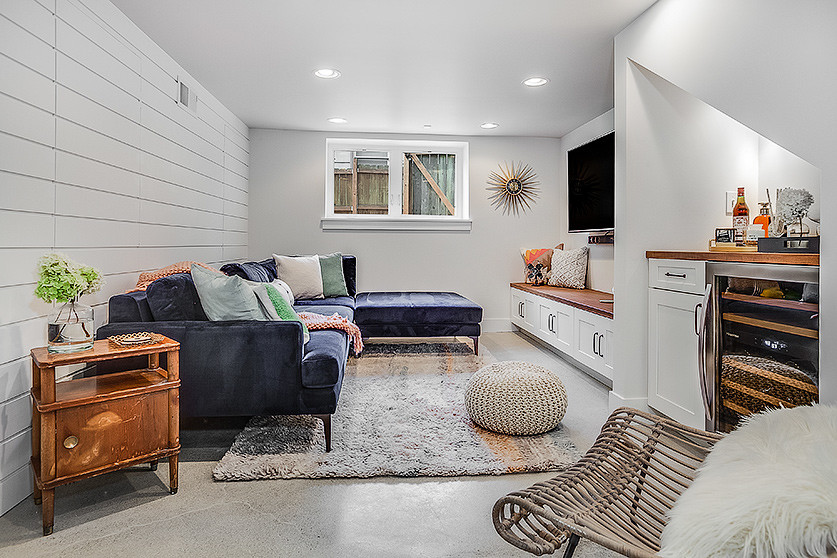 Inspiration for a transitional look-out basement in Seattle with white walls and no fireplace.