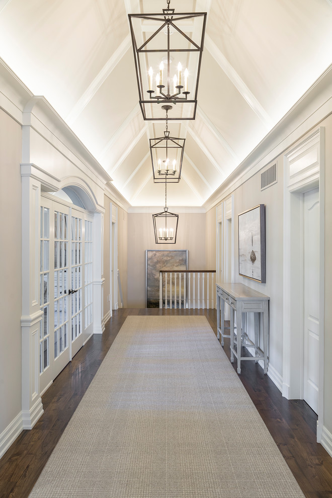 Design ideas for a beach style hallway in Toronto with beige walls, dark hardwood floors and brown floor.
