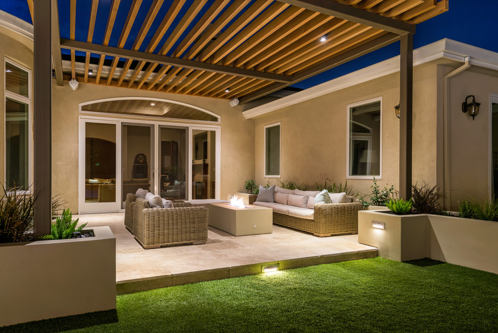 Design ideas for a mid-sized modern backyard patio in San Francisco with a fire feature, tile and a pergola.