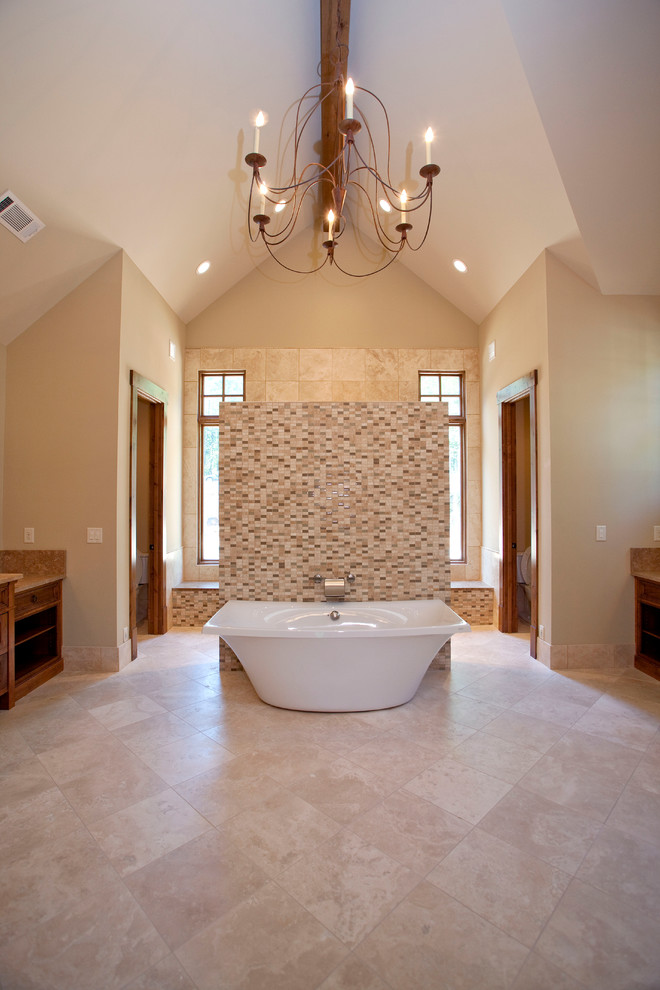 Design ideas for an expansive country master bathroom in Atlanta with raised-panel cabinets, light wood cabinets, a freestanding tub, an open shower, beige tile, brown tile, white tile, matchstick tile, beige walls, travertine floors, granite benchtops, beige floor and a hinged shower door.