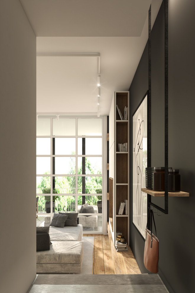 Photo of a small contemporary foyer in Turin with black walls, porcelain floors, a single front door, a black front door, grey floor and recessed.