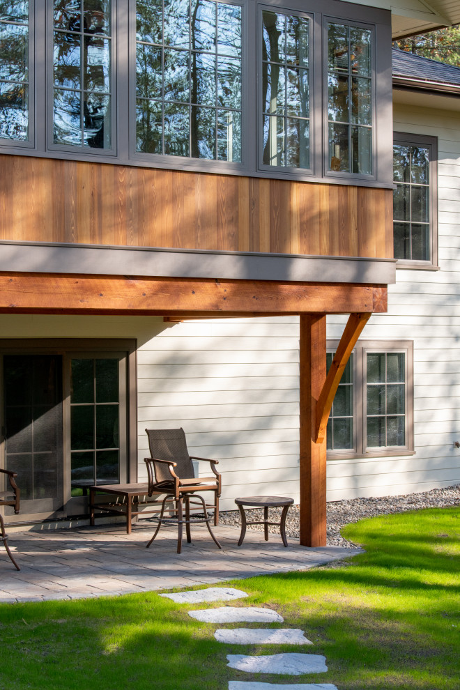 Example of a transitional home design design in Boston