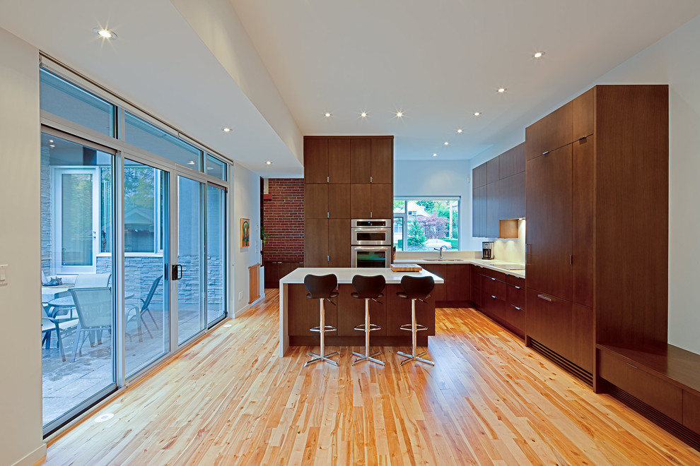 This is an example of a modern kitchen in Toronto with panelled appliances.