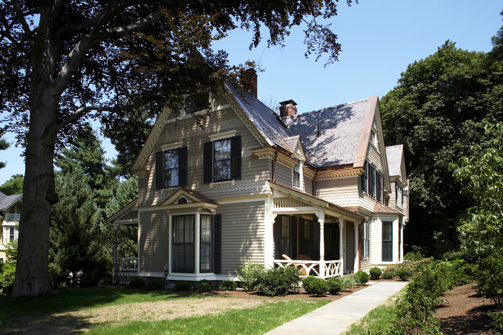 This is an example of a traditional exterior in Boston with wood siding.