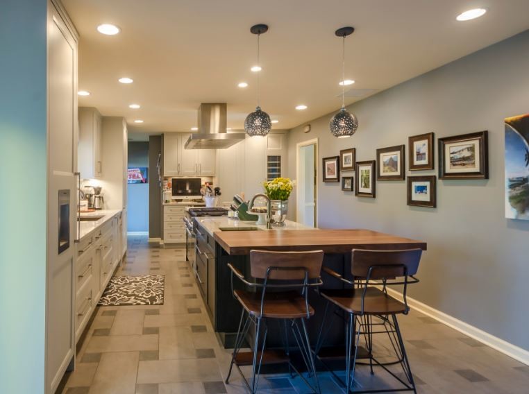 Enclosed kitchen - large transitional l-shaped cement tile floor and beige floor enclosed kitchen idea in Denver with an undermount sink, recessed-panel cabinets, gray cabinets, marble countertops, multicolored backsplash, paneled appliances, an island and gray countertops