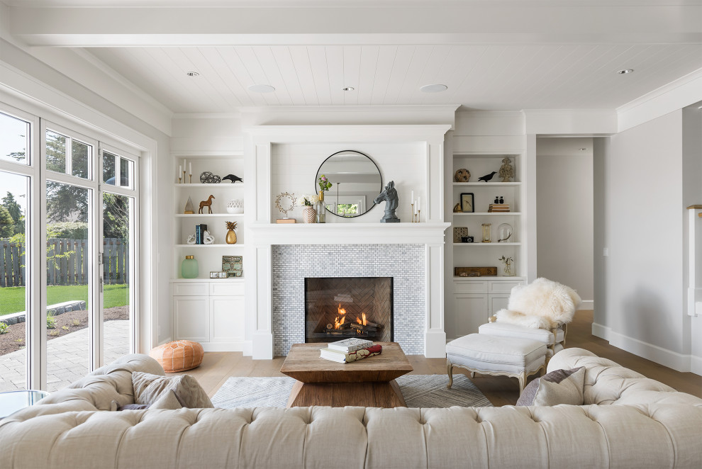 Photo of a mid-sized transitional formal open concept living room in Other with white walls, light hardwood floors, a standard fireplace, a tile fireplace surround, beige floor, no tv and timber.