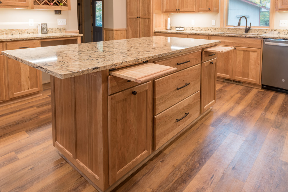 Photo of a large country eat-in kitchen in Minneapolis with recessed-panel cabinets, light wood cabinets, quartz benchtops, with island, multi-coloured benchtop and wood.