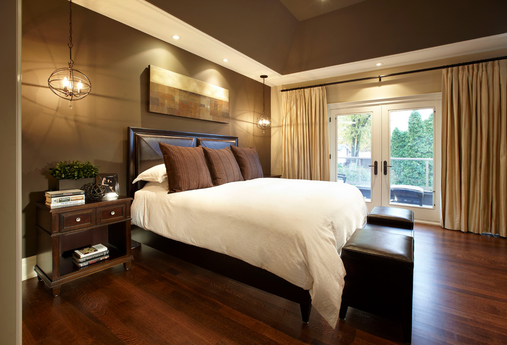 This is an example of a large contemporary master bedroom in Toronto with brown walls and medium hardwood floors.