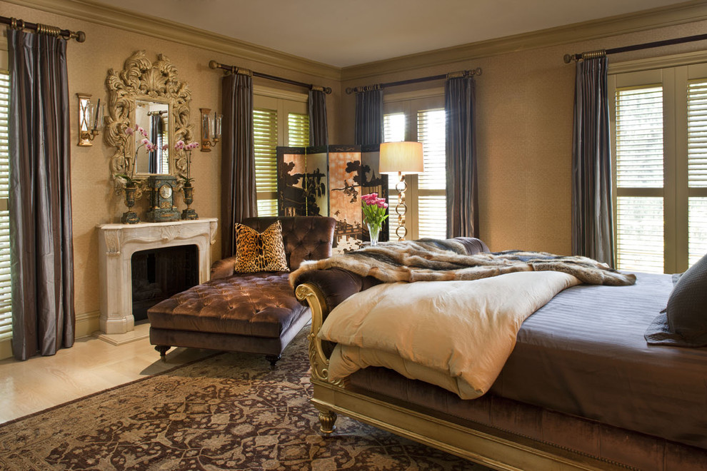 Photo of an eclectic bedroom in Los Angeles with a standard fireplace.