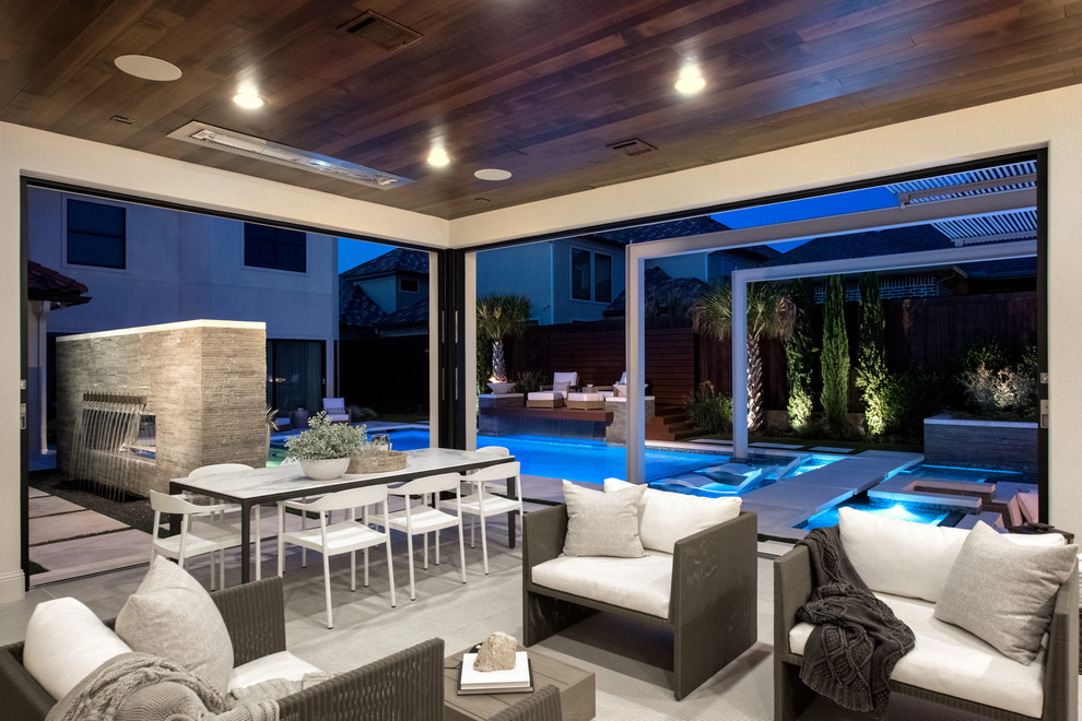 Photo of an expansive modern backyard rectangular pool in Dallas.