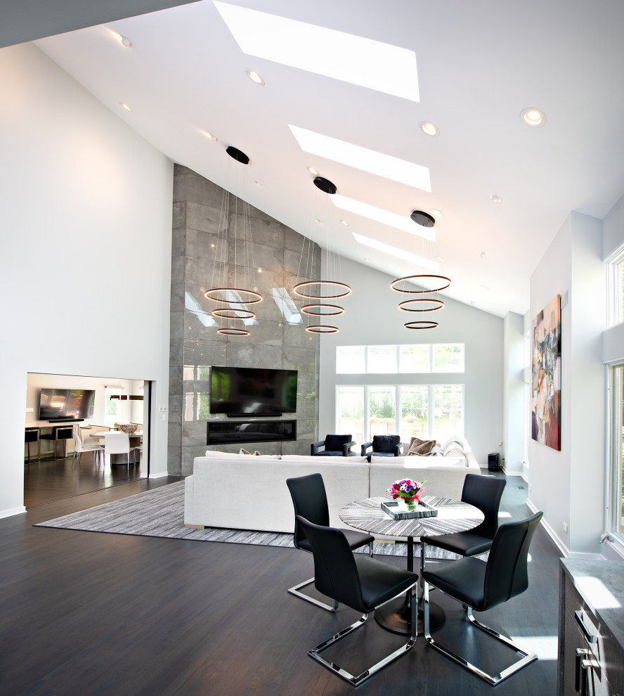 Living room - large modern open concept dark wood floor and brown floor living room idea in Chicago with a bar, a ribbon fireplace, a tile fireplace, a wall-mounted tv and gray walls