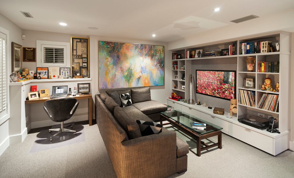 Contemporary family room in Vancouver with beige walls, carpet and a wall-mounted tv.